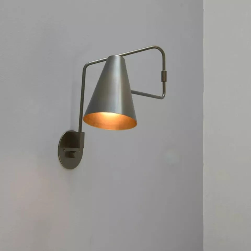 Moveable wall lamp offers flexible lighting with adjustable angle and direction.