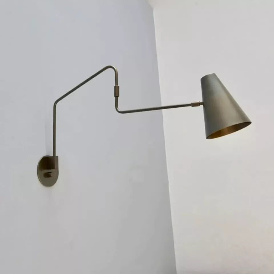 Moveable wall lamp offers flexible lighting with adjustable angle and direction.