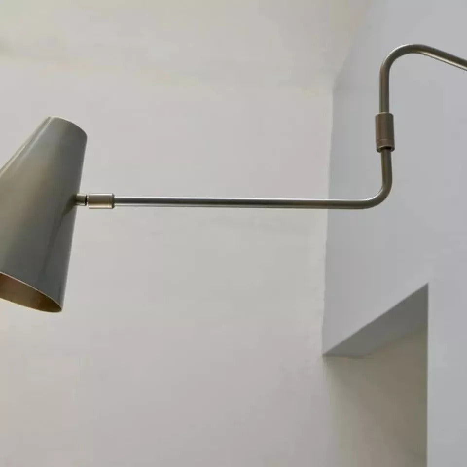 Moveable wall lamp offers flexible lighting with adjustable angle and direction.