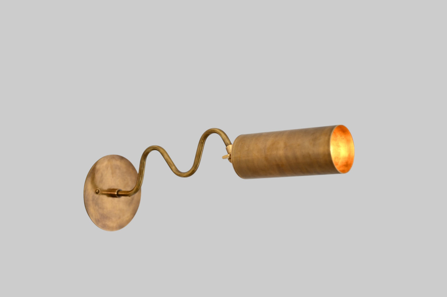 1-Light Italian ZigZag Sconce: Brass, sleek modern design, focused sculptural lighting