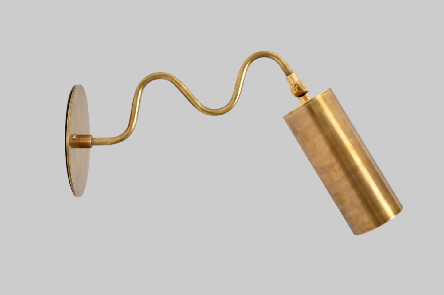 1-Light Italian ZigZag Sconce: Brass, sleek modern design, focused sculptural lighting