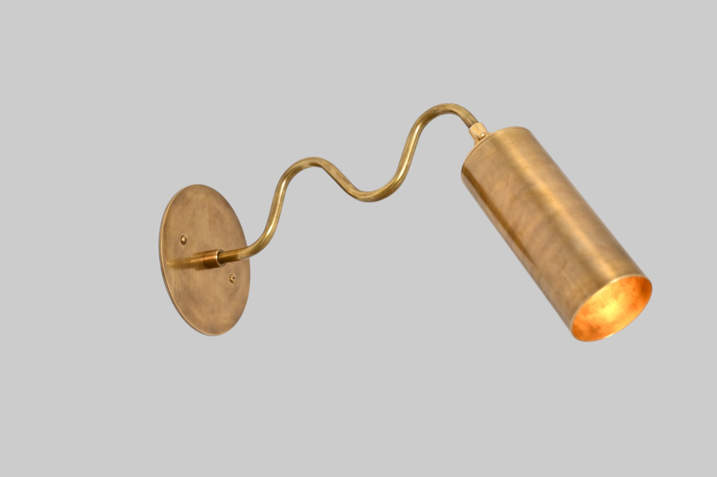 1-Light Italian ZigZag Sconce: Brass, sleek modern design, focused sculptural lighting